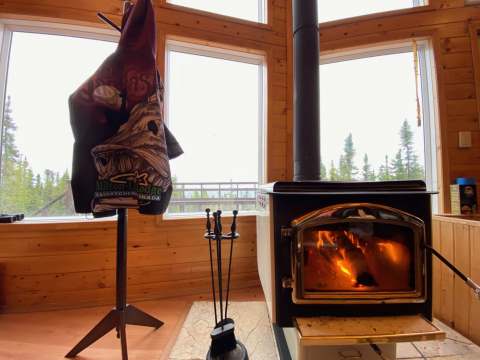 Enjoy the warmth of the wood stove in the main lodge living area.