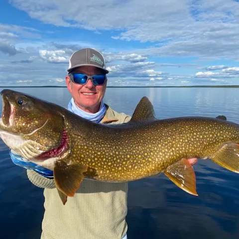 Catching lake trout in open water at Milton Lake Lodge, Athabasca Basin, Saskatchewan